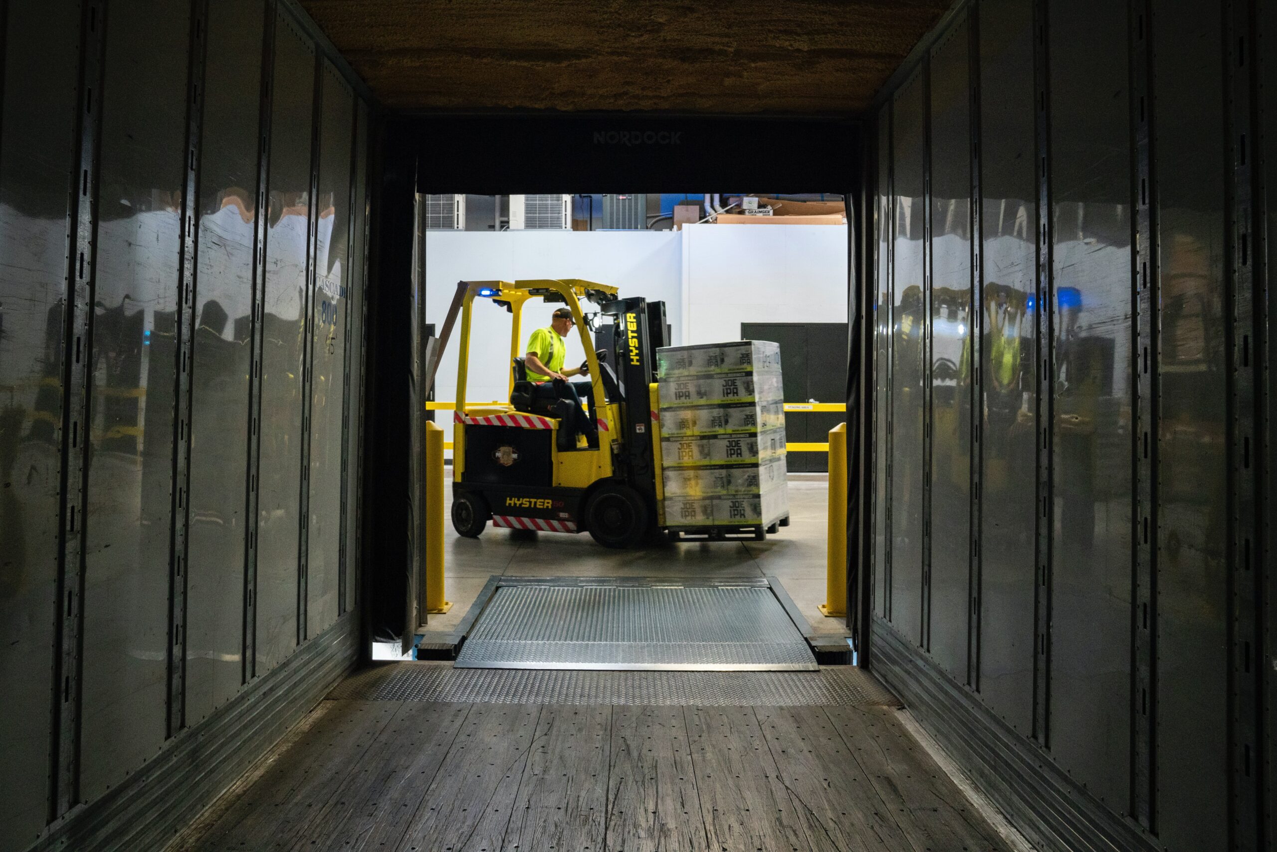 Man driving a machine transporting boxes